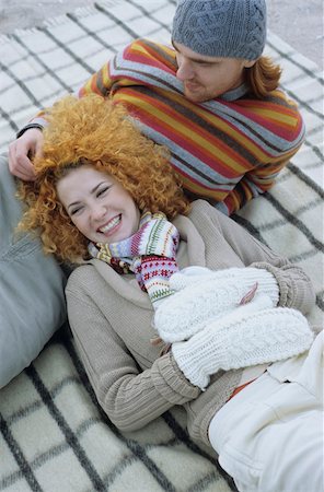 scarf curly woman - Young Woman with red Curls lying in the Lap of her Boyfriend - Relationship - Togetherness - Season Stock Photo - Premium Royalty-Free, Code: 628-02954666