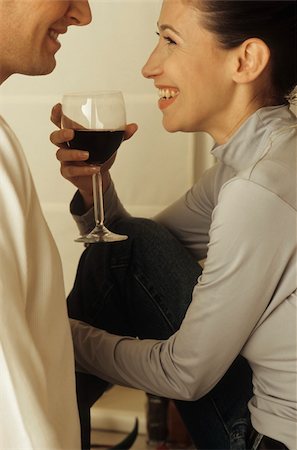 simsearch:628-02615784,k - Man standing in front of a Woman with a Glass of Wine in her Hand - Alcohol - Togetherness Stock Photo - Premium Royalty-Free, Code: 628-02954712