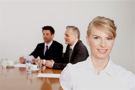 Three businesspeople in conference room, Bavaria, Germany Stock Photo - Premium Royalty-Free, Code: 628-02953630