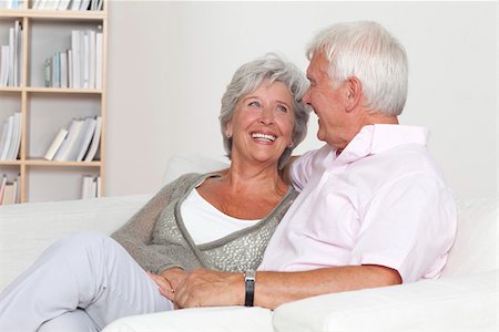 elderly couple in home - Happy senior couple on sofa Stock Photo - Premium Royalty-Free, Code: 628-03201136