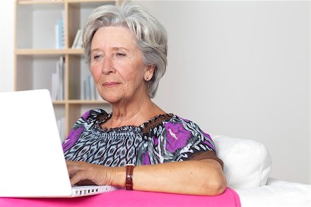 Senior woman using laptop Stock Photo - Premium Royalty-Free, Code: 628-03201138