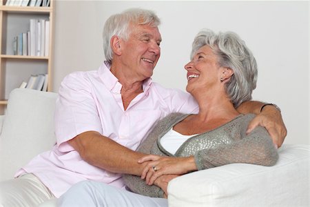 simsearch:628-03201152,k - Senior couple hugging on sofa Stock Photo - Premium Royalty-Free, Code: 628-03201154