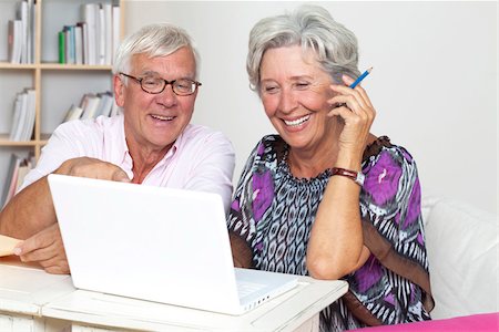 elderly couple in home - Happy senior couple using laptop Stock Photo - Premium Royalty-Free, Code: 628-03201163