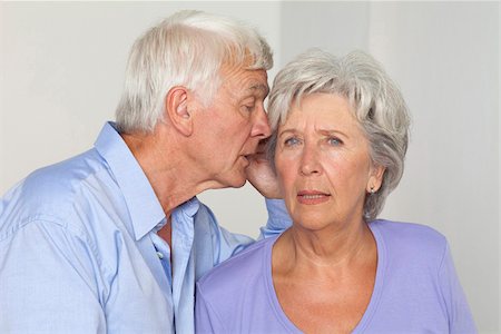 debates - Senior couple whispering Stock Photo - Premium Royalty-Free, Code: 628-03201189