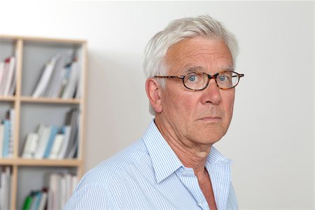 sad 60 year old people - Pensive senior man wearing glasses Stock Photo - Premium Royalty-Free, Code: 628-03201204