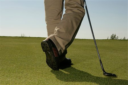 shoes wearing man - Man on golf course Stock Photo - Premium Royalty-Free, Code: 628-03201249