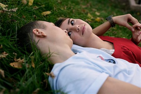 Teenage couple lying on grass Stock Photo - Premium Royalty-Free, Code: 628-03201428