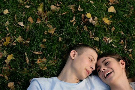 Teenage couple lying on grass Stock Photo - Premium Royalty-Free, Code: 628-03201437