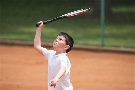 raqueta - Young Boy Preparing For Hitting Shot Foto de stock - Sin royalties Premium, Código: 622-05390905