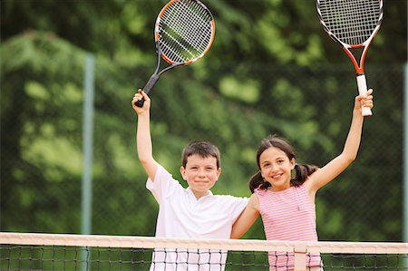 pictures of pre teen boys in tank tops - Boy And Girl Celebrating Stock Photo - Premium Royalty-Free, Code: 622-05390902