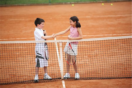 preteens in skirts not adult full body - Young Tennis Players Shaking Hands Stock Photo - Premium Royalty-Free, Code: 622-05390917