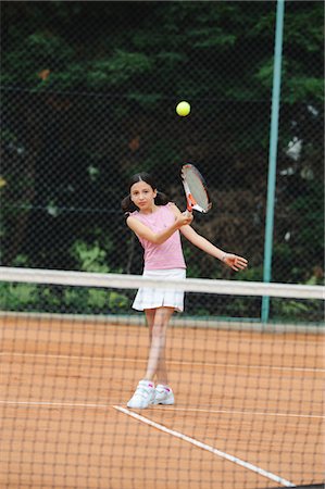 preteen tennis - Girl Playing Tennis Stock Photo - Premium Royalty-Free, Code: 622-05390918