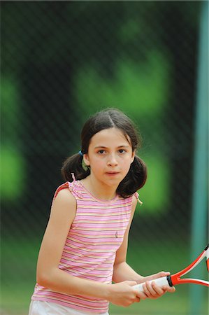 physical activity child - Girl Playing Tennis Stock Photo - Premium Royalty-Free, Code: 622-05390922