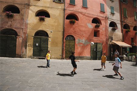 side profile of a soccer ball - Children Playing Soccer In Street Stock Photo - Premium Royalty-Free, Code: 622-05390938