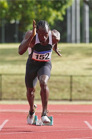 Athlete Running Away From Starting Blocks Foto de stock - Sin royalties Premium, Código: 622-05602884