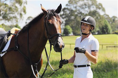 Young Horseback Rider Smiling Foto de stock - Sin royalties Premium, Código: 622-05786742