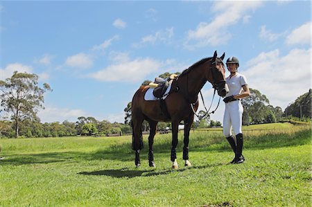 simsearch:622-05786789,k - Young Woman Horseback Rider with Brown Horse Foto de stock - Sin royalties Premium, Código: 622-05786771