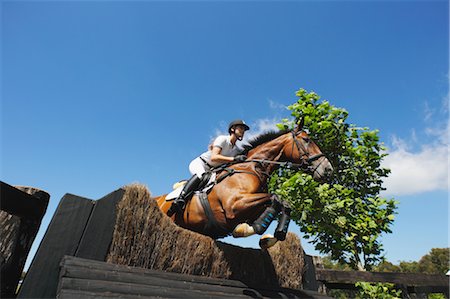 ecuestre - Woman Horseback Rider Jumping Horse Foto de stock - Sin royalties Premium, Código: 622-05786793
