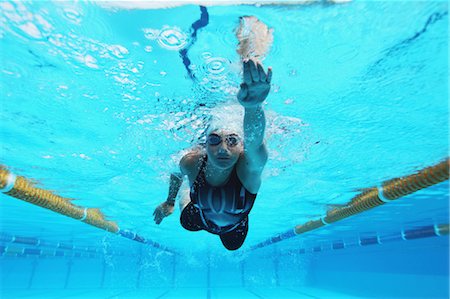 swimming (competitive) - Woman Swimming in Pool, Underwater Stock Photo - Premium Royalty-Free, Code: 622-05786819