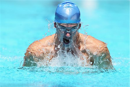 simsearch:622-05786752,k - Young Man Swimming Breaststroke Foto de stock - Royalty Free Premium, Número: 622-05786824