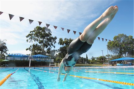 simsearch:649-08560912,k - Young Woman Diving into Swimming Pool Stock Photo - Premium Royalty-Free, Code: 622-05786843