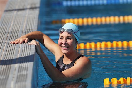 swimming goggles - Young Woman Swimmer Smiling Stock Photo - Premium Royalty-Free, Code: 622-05786859