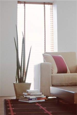 simsearch:622-06190732,k - Sofa And Potted Plat Beside Window Stock Photo - Premium Royalty-Free, Code: 622-06009533