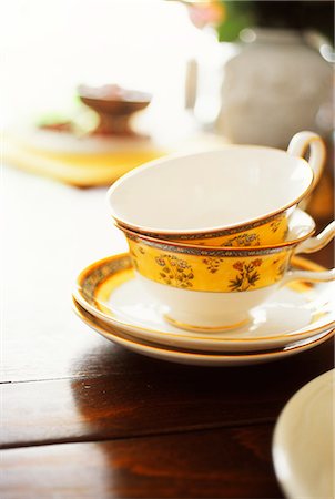 elegant kitchen - Teacups And Saucers On Table Stock Photo - Premium Royalty-Free, Code: 622-06009751