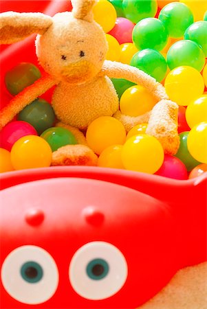 simsearch:622-06009833,k - Teddy In Multicolor Toy Balls Stock Photo - Premium Royalty-Free, Code: 622-06009827