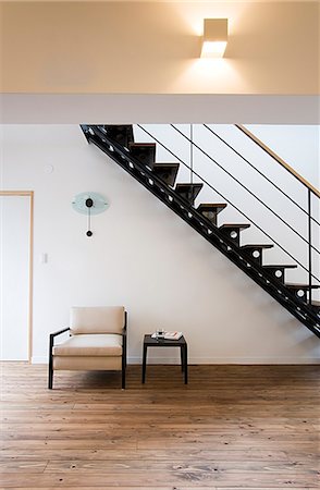 empty room with wooden floor - Easy Chair, Table And Staircase Stock Photo - Premium Royalty-Free, Code: 622-06009869