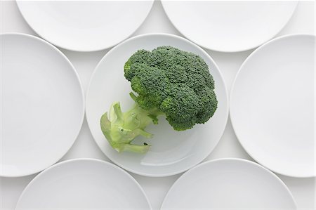 simsearch:622-06163876,k - Plates Arranged Around Broccoli Plate Stock Photo - Premium Royalty-Free, Code: 622-06163833