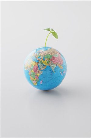 Plant Growing On Planet Earth Foto de stock - Sin royalties Premium, Código: 622-06163967