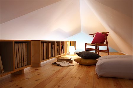 Books In Bookshelf With Cushion, Lamppost And Chair On Wooden Floor Stock Photo - Premium Royalty-Free, Code: 622-06190729