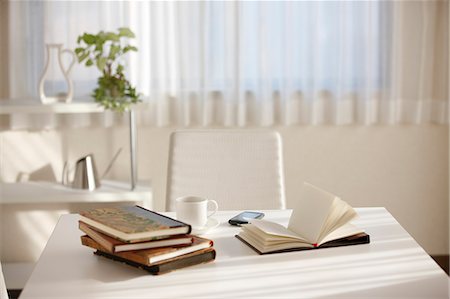 simsearch:622-06190732,k - Stack Of Books, Teacup And Cellular Phone On Table Stock Photo - Premium Royalty-Free, Code: 622-06190741