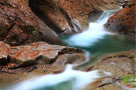 Waterfall In Forest Stock Photo - Premium Royalty-Free, Code: 622-06190812