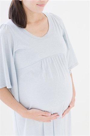 pregnant asian belly - Pregnant woman Stock Photo - Premium Royalty-Free, Code: 622-06369632