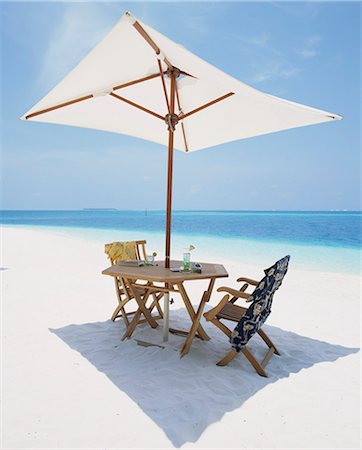 White beach, umbrellas and tables Stock Photo - Premium Royalty-Free, Code: 622-06370196