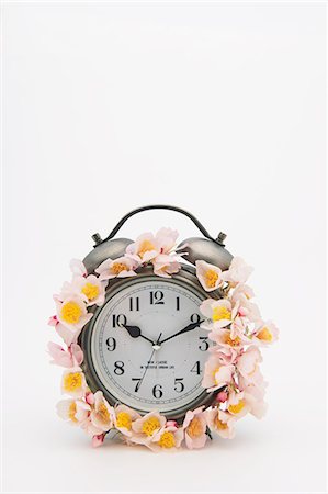 Alarm clock with cherry blossoms Stock Photo - Premium Royalty-Free, Code: 622-06397757
