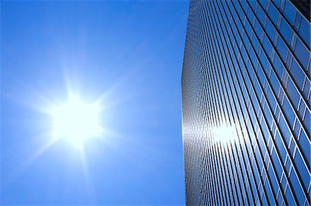 exterior office buildings - Sun reflecting on office building windows Stock Photo - Premium Royalty-Free, Code: 622-06439263