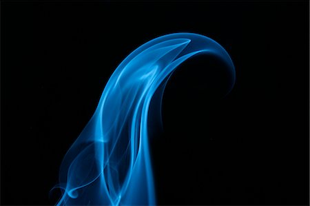Blue smoke on black background Stock Photo - Premium Royalty-Free, Code: 622-06486713