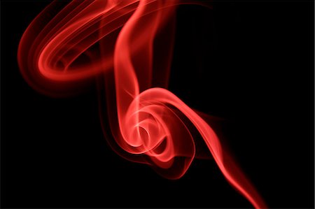 Red smoke on black background Stock Photo - Premium Royalty-Free, Code: 622-06486728