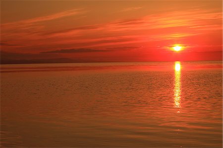 red orange sunset - Lake Saroma at sunset, Hokkaido Stock Photo - Premium Royalty-Free, Code: 622-06487159