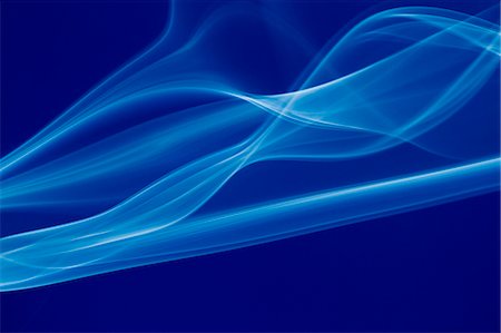 Blue smoke on blue background Stock Photo - Premium Royalty-Free, Code: 622-06548881