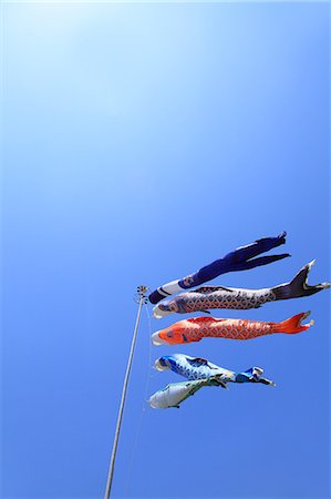 Blue sky and flying carps Stock Photo - Premium Royalty-Free, Code: 622-06809672
