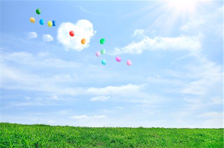 rainy skies - Grassland and sky with flying balloons Stock Photo - Premium Royalty-Free, Code: 622-06842534