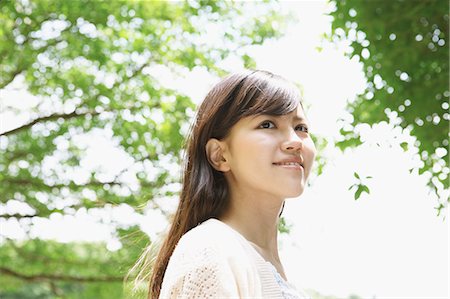 simsearch:622-06900452,k - Young woman smiling away Stock Photo - Premium Royalty-Free, Code: 622-06900449