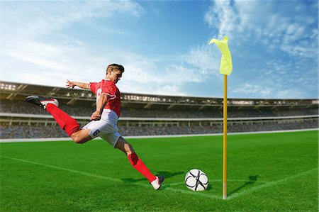 shooting soccer ball cutout - Soccer Player Taking Corner Kick Stock Photo - Premium Royalty-Free, Code: 622-07736018