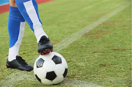 soccer player (male) - Football player stopping the ball Stock Photo - Premium Royalty-Free, Code: 622-07736043