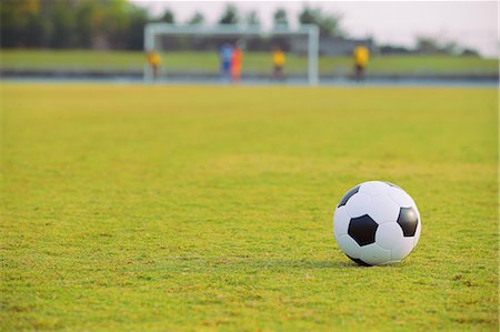 soccer ball outdoor - Soccer ball on soccer field Stock Photo - Premium Royalty-Free, Code: 622-07736077