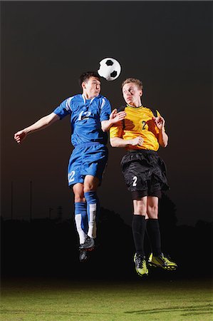 simsearch:622-07736077,k - Football players aiming for the ball Stock Photo - Premium Royalty-Free, Code: 622-07736083